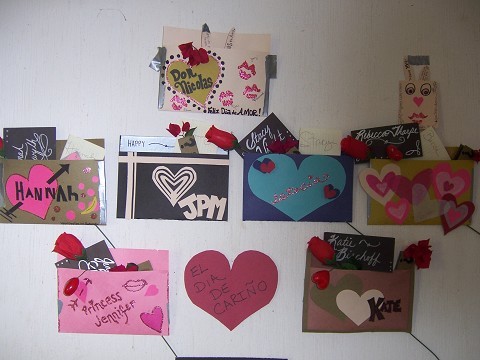 Valentines Pouches.... ths isnt the best picture, but I HAD to use it. All my other photos of our wall of V-day pouches contained some 'sensitive' slash 'secret admirer' type information that cannot be shared. (haha) Curious??? Winks.