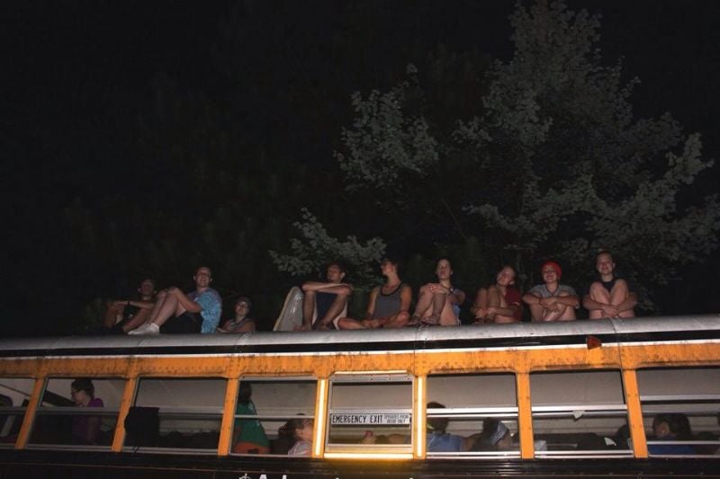 Sitting on top of the bus just before sunrise