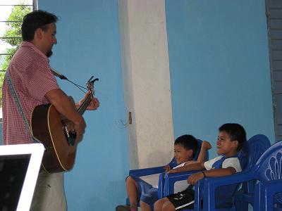 Brian playing guitar for the kids