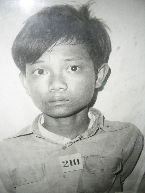Picture of a boy at S21 center during the time of the Khmer Rouge