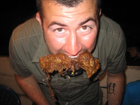 Eating a chicken head in Palenque