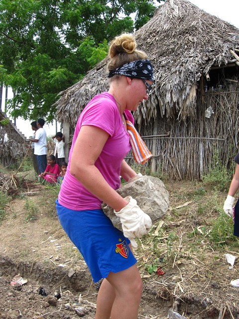 Carrying the rocks for the foundation, church building, India