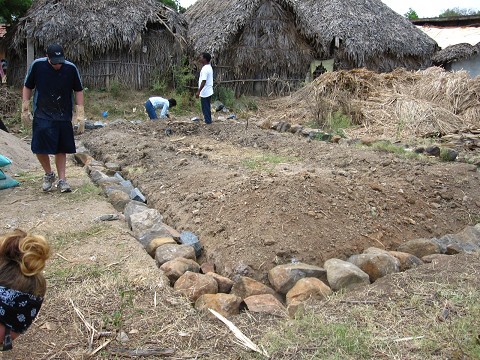 first layer of stones in the foundation. India church build