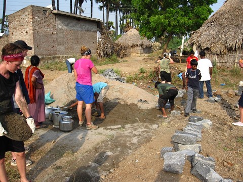 pouring cement, church building, India