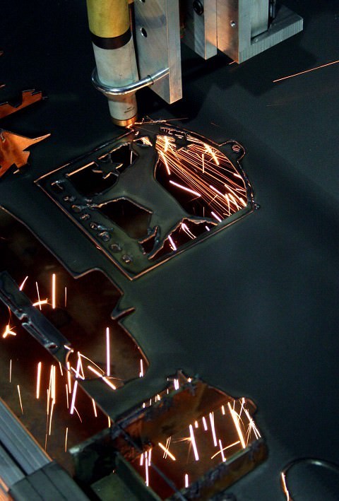 This is a machine that cuts through sheet metal with somekind of plasma ray.