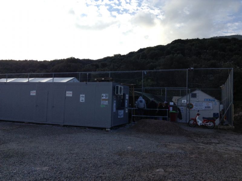 The camp refugees go through to get clothes, food, water. They then wait for a bus to take them to a city an hour and a half away to wait for a ferry.