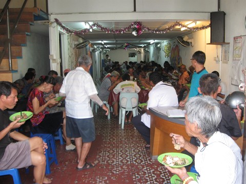Homeless eating lunch at the Kawan center in Penang, Malaysia.