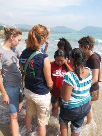 Our team praying over Ae after she was baptized