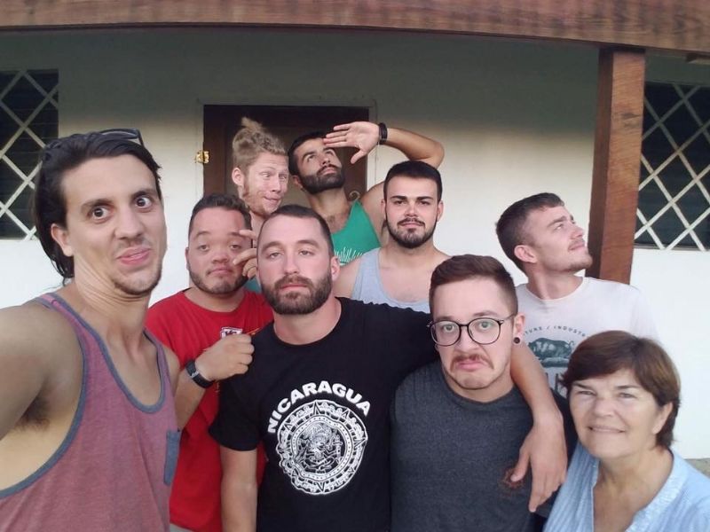 The men and Miss Mona, one of our hosts