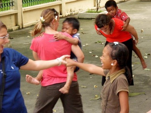 Kara, Lisa,  and  Jennifer outside playing.  Most of us will be going there everyday during the week for ministry.