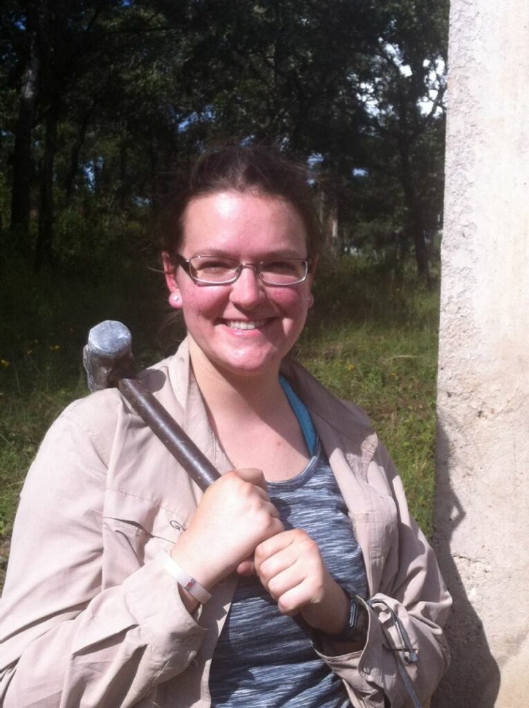 Me at the ministry site, breaking down the old concrete walls with a hammer.