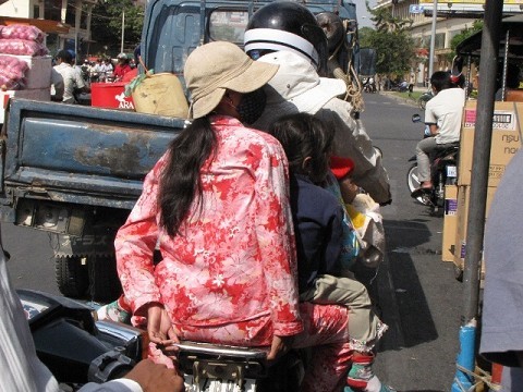 it's hard to see, but there are actually 6 people on this moto