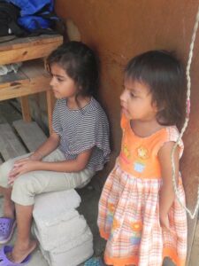 This is a picture of two of the little girls who were sitting on the sidelines watching the group playing.